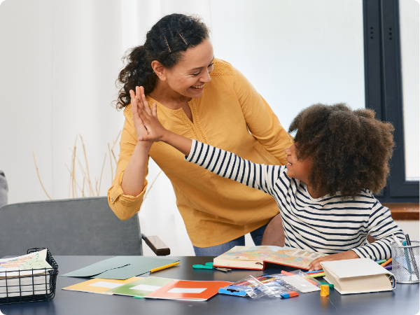 woman high-fiving a kid