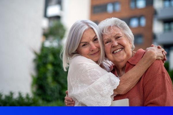 2 older white women hugging each other