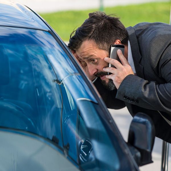 Panicked man outside of car