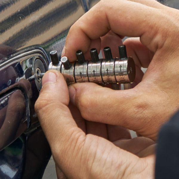 advanced lockpicking tool in a car door lock