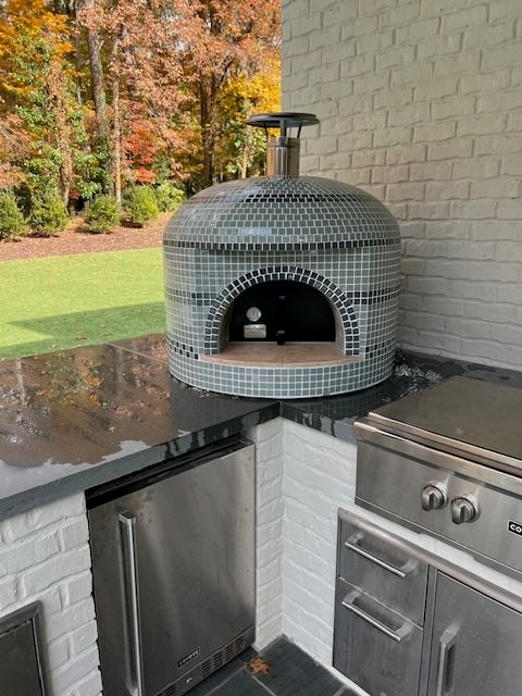 Forno Bravo pizza oven installed by StoneAge Stonescapes
