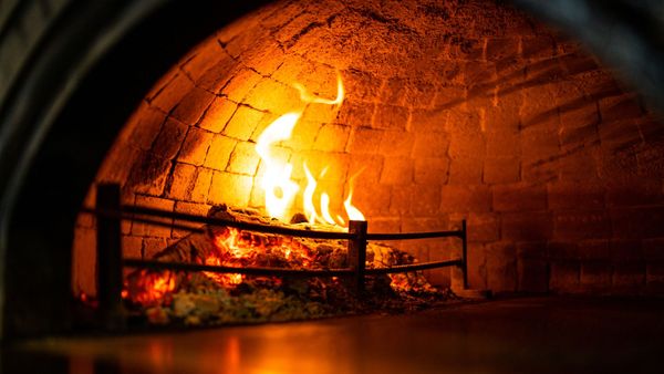 wood fire in stone oven