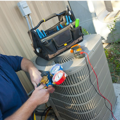 Image of a man working on an AC