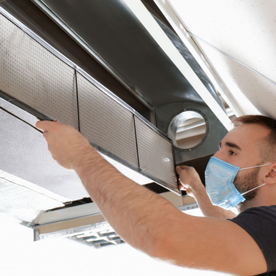 contractor inspecting duct