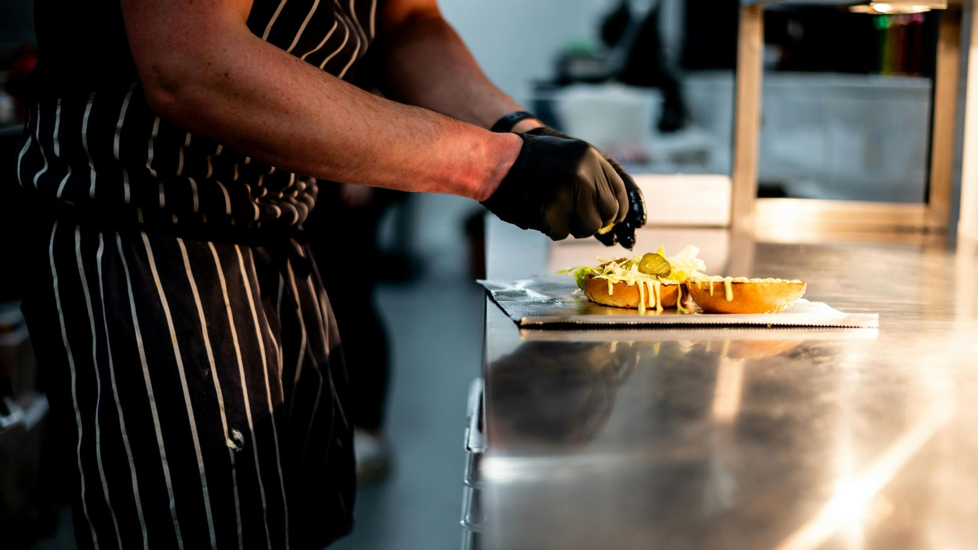 preparing bagel in commercial restaurant preparing bagel in commercial restaurant