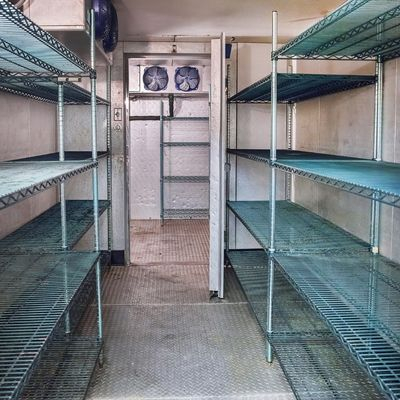 Empty commercial walk in refrigerator