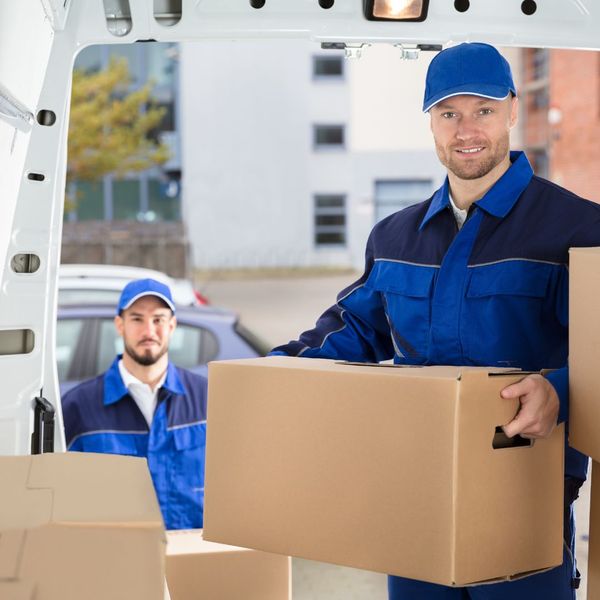 smiling movers loading truck