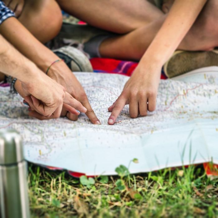 People looking at a map and pointing. 