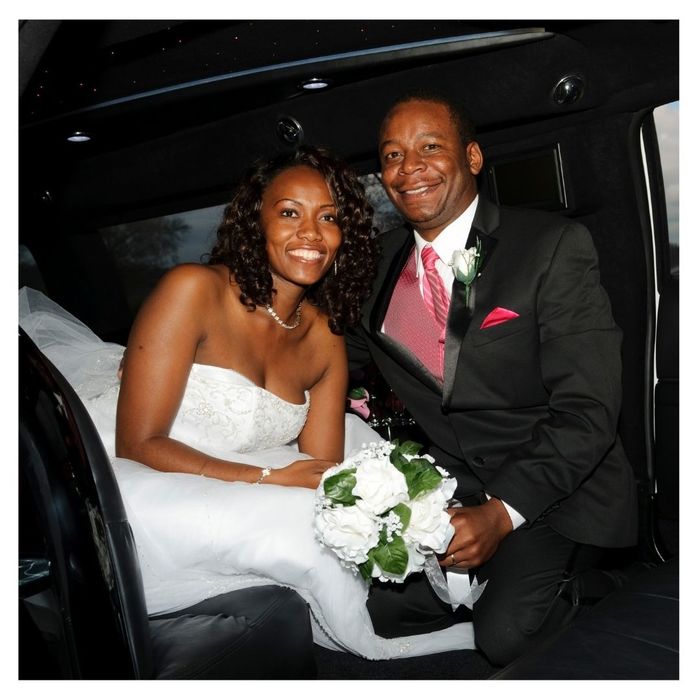 A newely wed couple in a limo