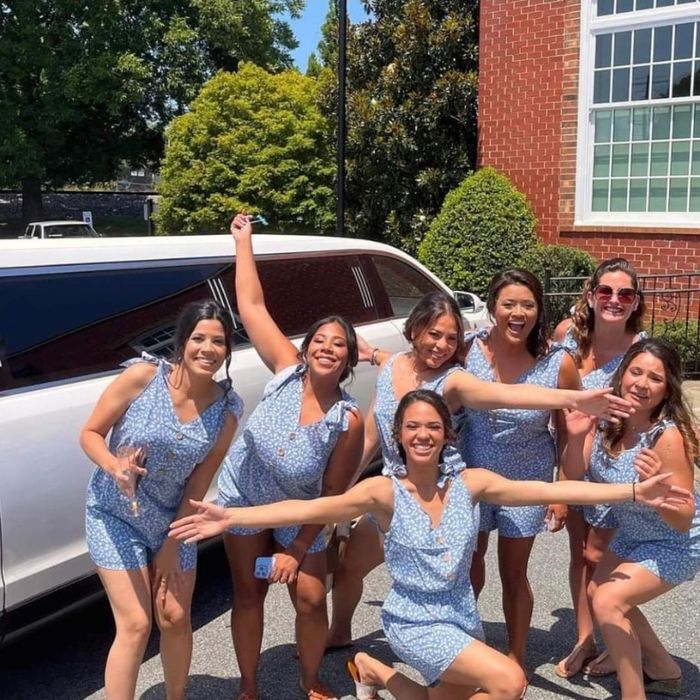 Bridal party outside of limo