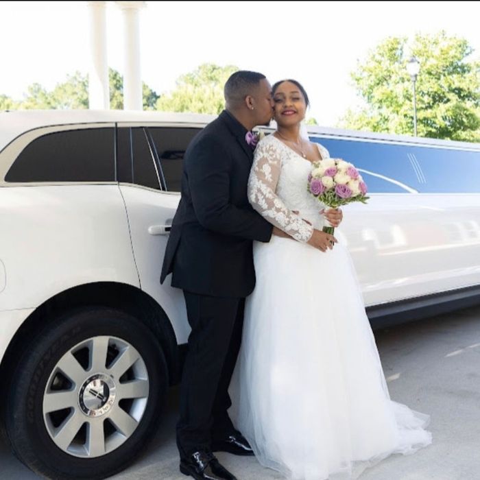 Husband and Wife outside of a limo