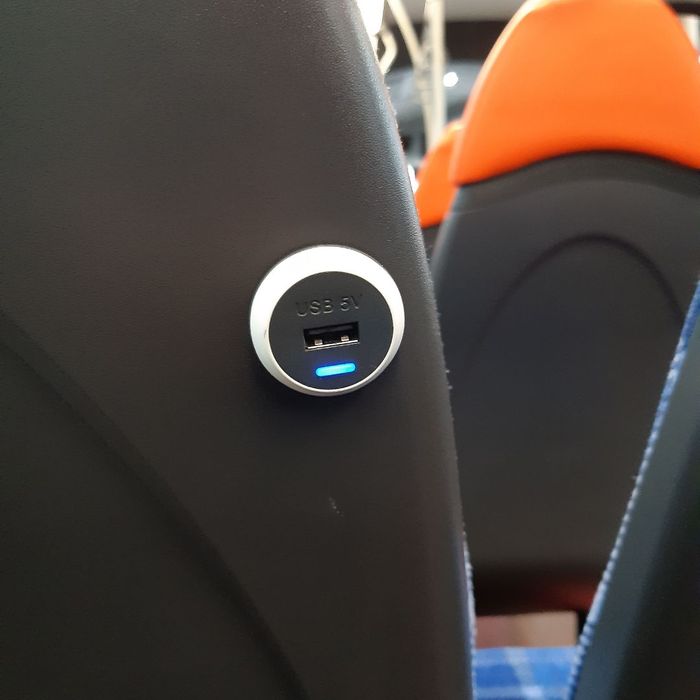 USB on the back of a bus seat. 