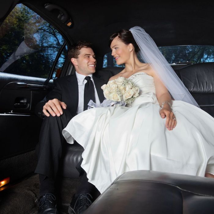 A married couple in a limo