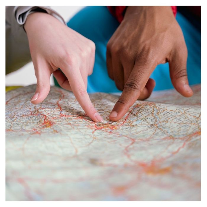 people pointing at a map