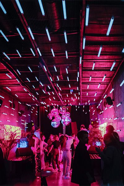 Indoor party with colorful lights and disco balls