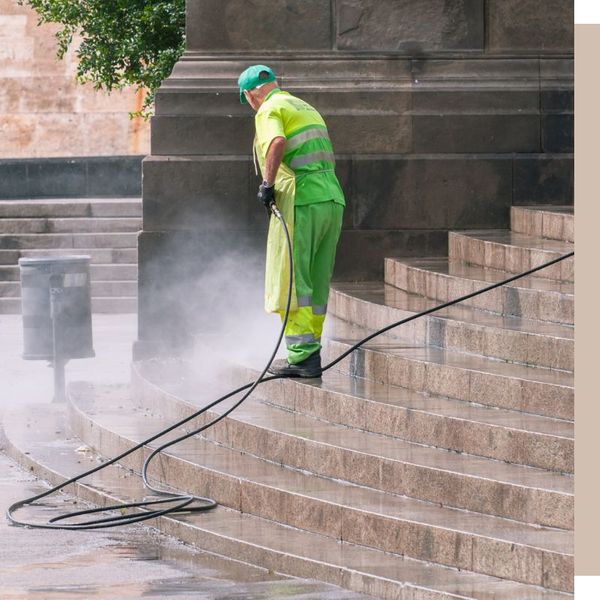 man pressure washes stairs man pressure washes stairs
