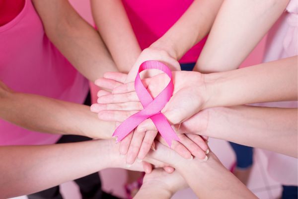 hands holding a breast cancer awareness ribbon