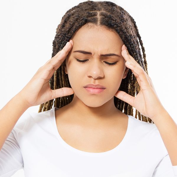 Image of a young woman with a headache