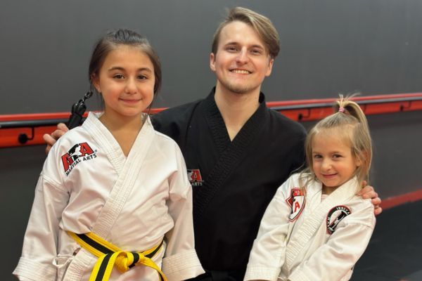 kids smiling at martial arts class