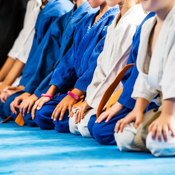 martial arts students sitting 