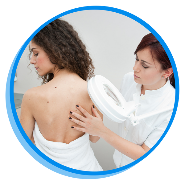dermatologist examining the moles on a woman's back