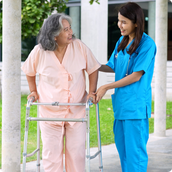 woman caregiver helping an elderly woman. 