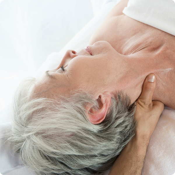 senior woman getting neck massage