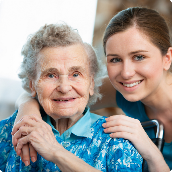 elderly woman with care giver