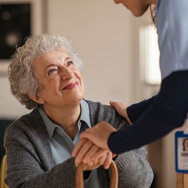 senior smiling at caregiver