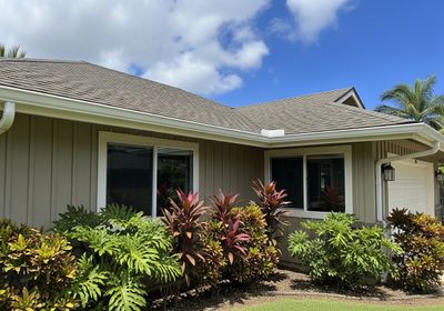 Beautiful Home Exterior with Tropical Plants