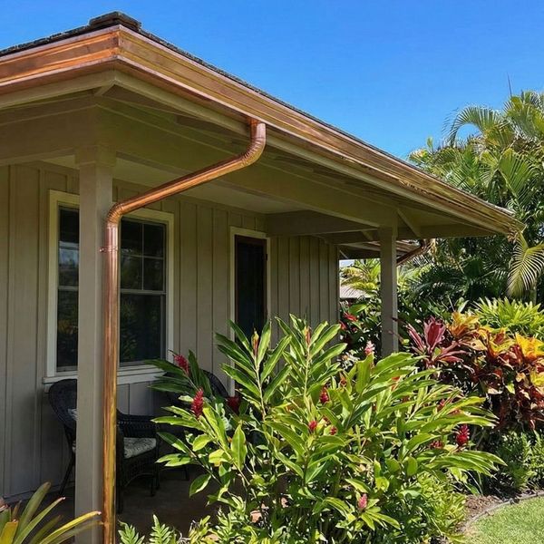 new copper seamless gutters on a Hawaiian-style house