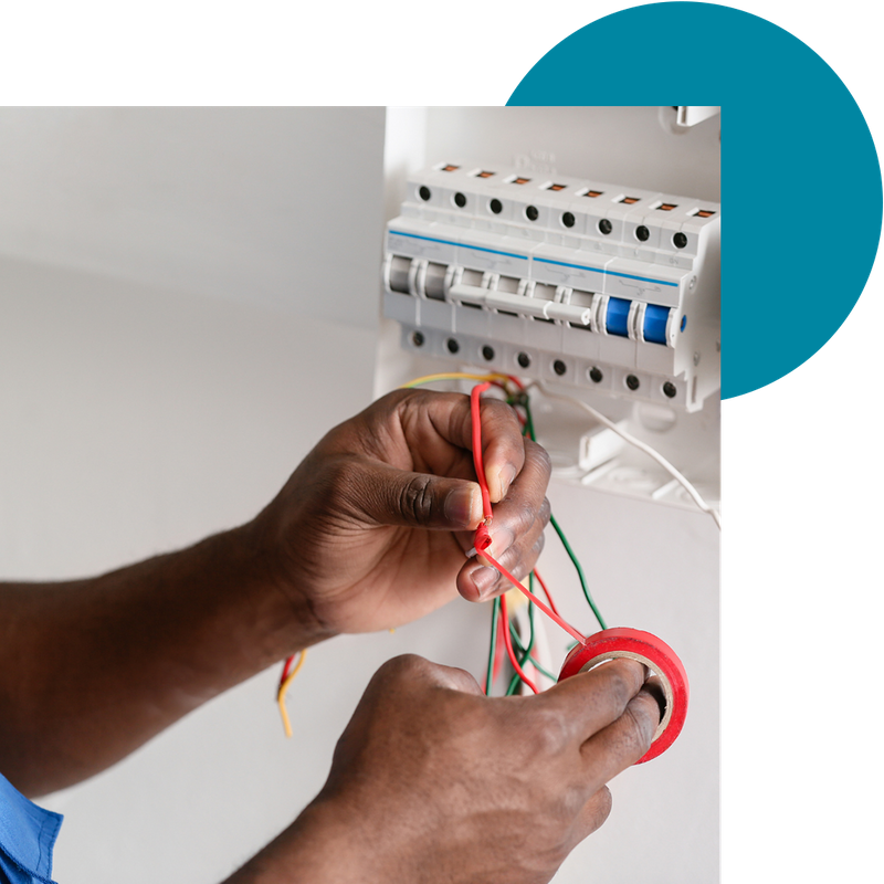 An electrician rewiring a home's electrical system
