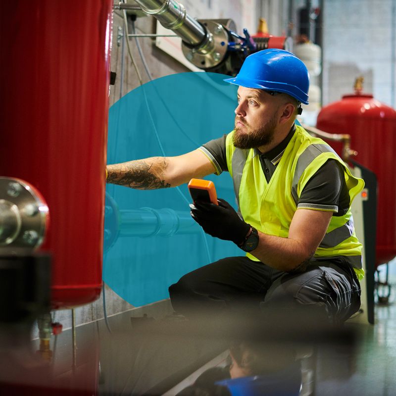 An electrician working inside a facility 