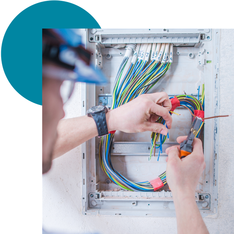 An electrician diagnosing an electrical issue in a home