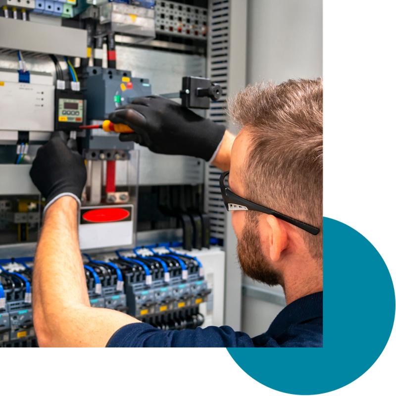 An electrician working on an electrical system