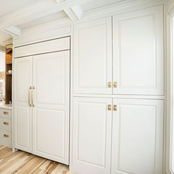 white kitchen cabinets with simple handles