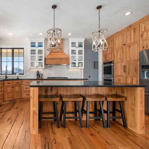 a kitchen with wooden cabinets Home.jpg