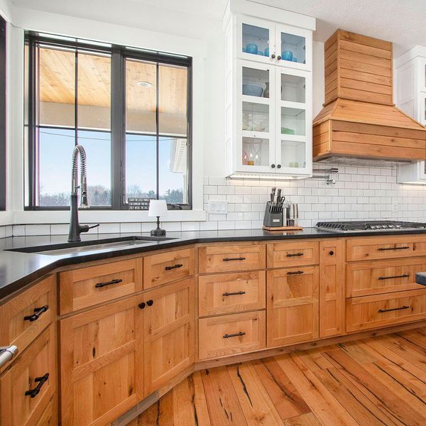 brown cabinets that round a kitchen corner Kitchen.jpg