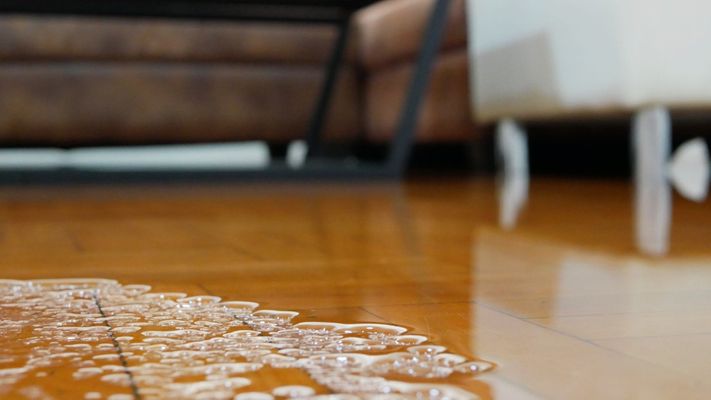 puddle of water on the floor 4 Signs That You Need Water Damage Restoration Services Hero.jpg