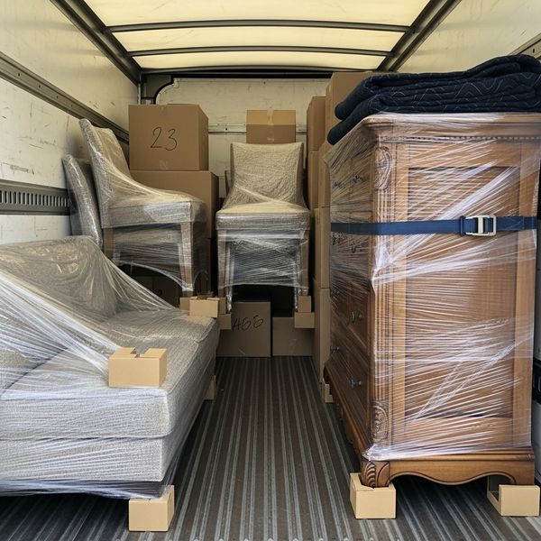 Neatly packed and protected furniture ready for safe transport.