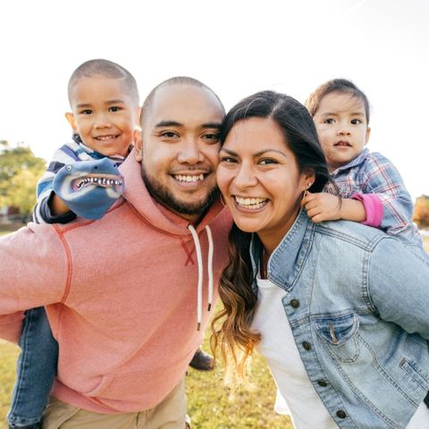 smiling family outside