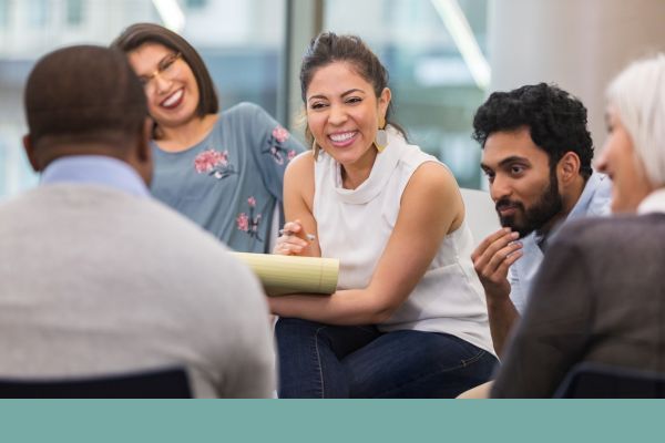 diverse group of smiling people in therapy