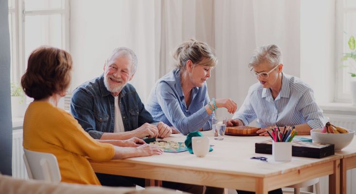 People playing board games together Explore the Exciting Activities at Riviera Living Hero.jpg
