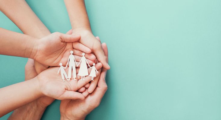 family cutout in hands family cutout in hands