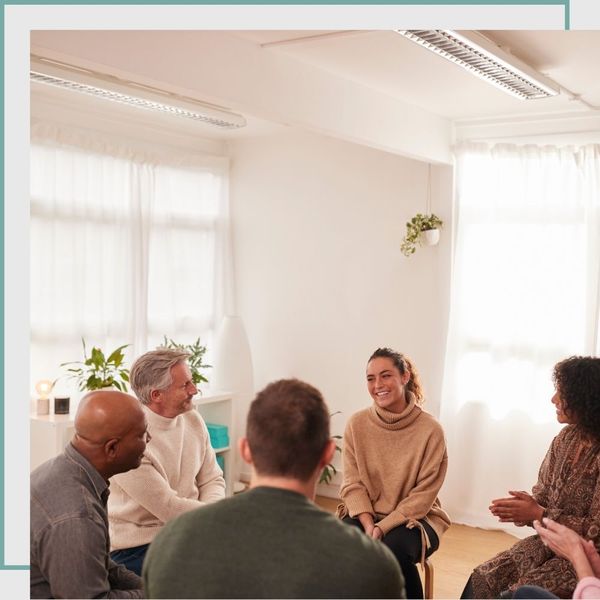 group of people in therapy session