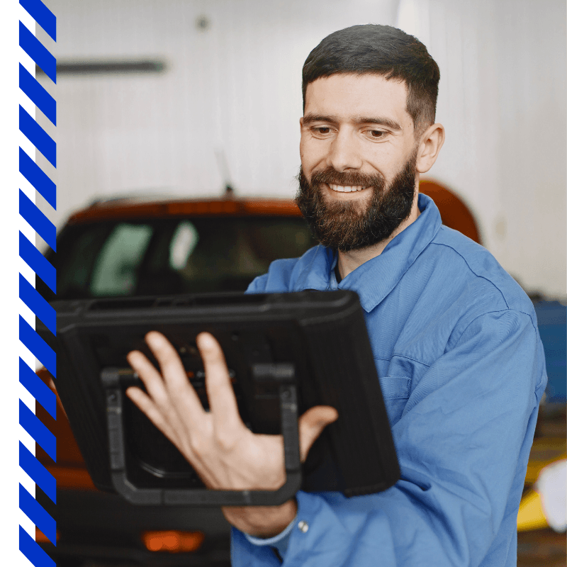 mechanic holding a tablet