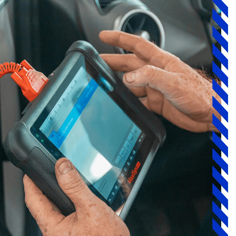 mechanic on a diagnostic tablet