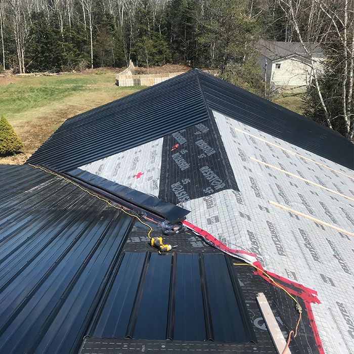 Metal roofing being installed on roof