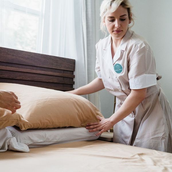 woman making bed woman making bed