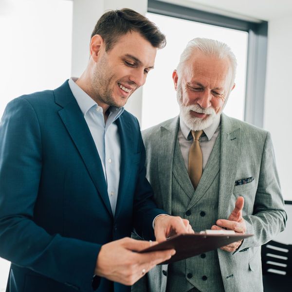 business people looking at a quote happily